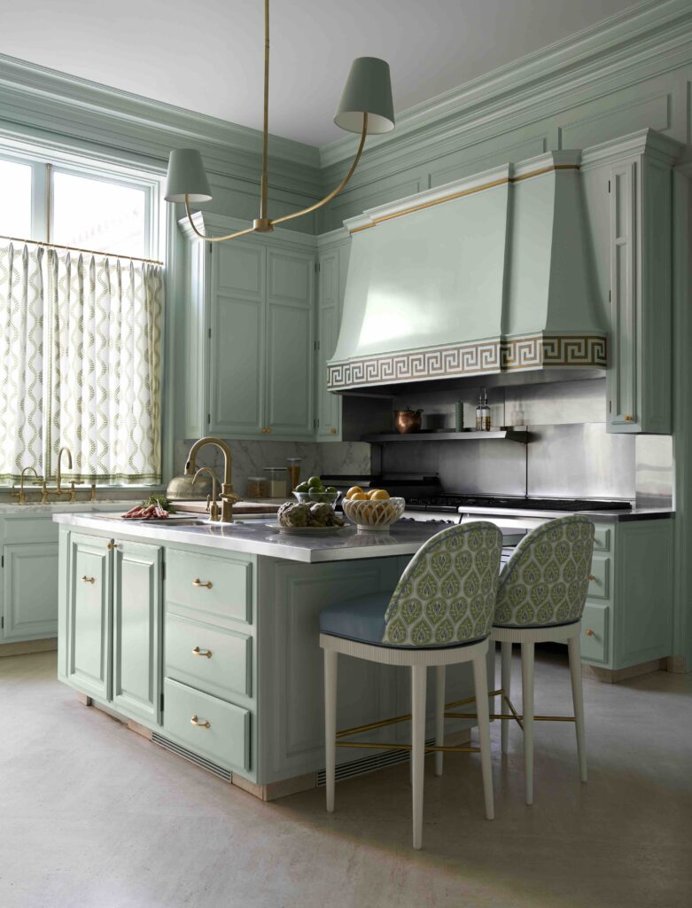 In the Young Estate in Fort Worth, a custom vent hood in the kitchen is designed by Carla Fonts, and made by Brent Hull of Hull Millworks. Sherle Wagner fixtures and hardware. Marble counters from Stone Boutique. (Photo by Pär Bengtsson)