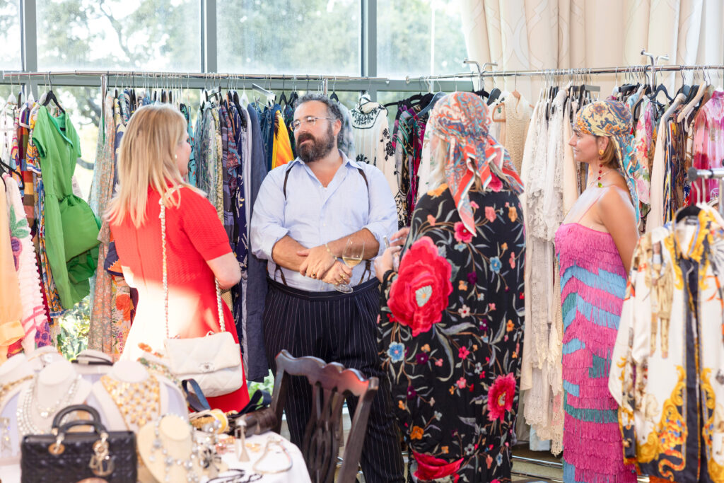 Ryah Nixon discussing all things vintage with the Morphew World team at the preview party. (Photo by Ellman Photography)