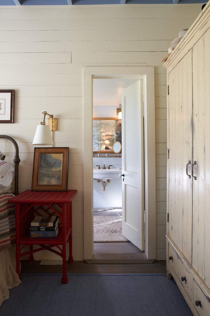 The farmhouse has no closets, so Curtis designed an armoire for the main bedroom, which has been painted. (Photography Pär Bengtsson)