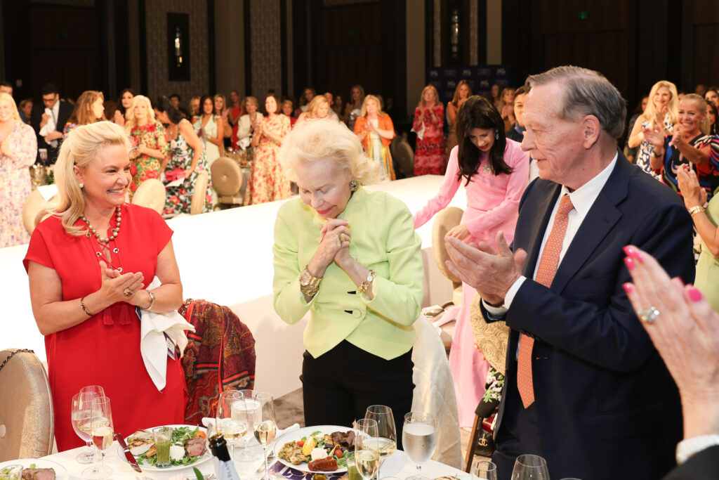 PaperCity Philanthropy in Fashion Best Dressed Icon Lynn Wyatt overwhelmed by the standing ovation she received at the 2024 PaperCity Philanthropy in Fashion Best Dressed luncheon benefiting March of Dimes. (Photo by Priscilla Dickson)