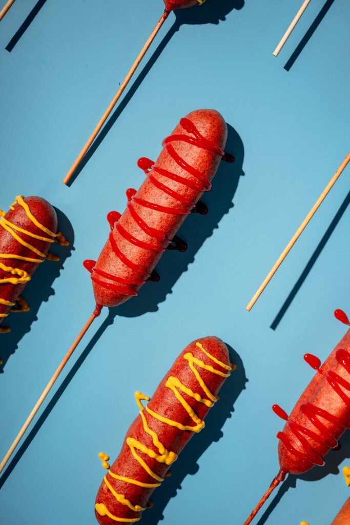 Starting with choice ingredients, the likes of which are used in their fine dining enclaves, you’ll find beef patties, corn dogs (shown), and hot dogs made with 100% Wagyu beef from Marfa, Texas, and locally raised, free-range chicken. (Photo by Brian Kennedy)