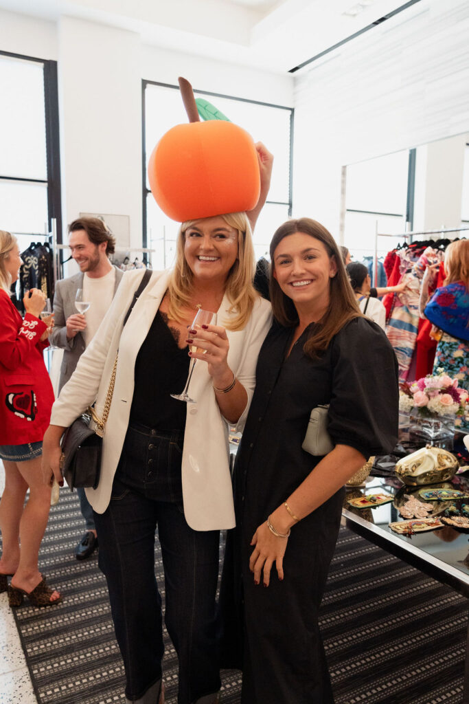 A playful moment costume moment with Lauren Gray and Emily Gray at the Orange Show's Dalidada dress-up party at Tootsies.  (Photo by Jane Perkins)