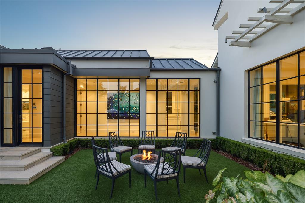 The turf grass lawn and firepit add to the 3509 Crescent Avenue's tempting outdoor retreat.