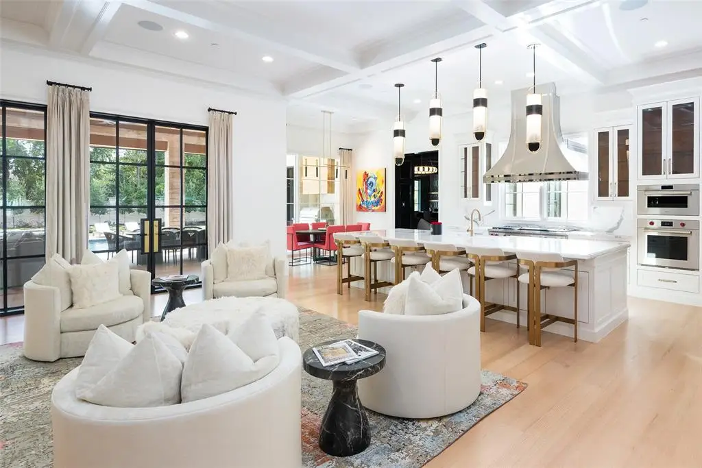 The open floor plan at 5414 Elden Drive features industrial-grade appliances in the kitchen.