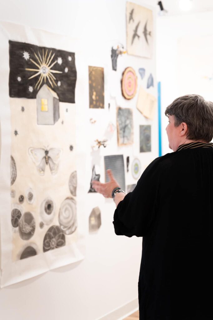 Artist Ellen H. Ray talks through her starting point — her mood board  — at her Ardest Gallery solo show in The Woodlands. (Photo courtesy of Ardest Gallery)