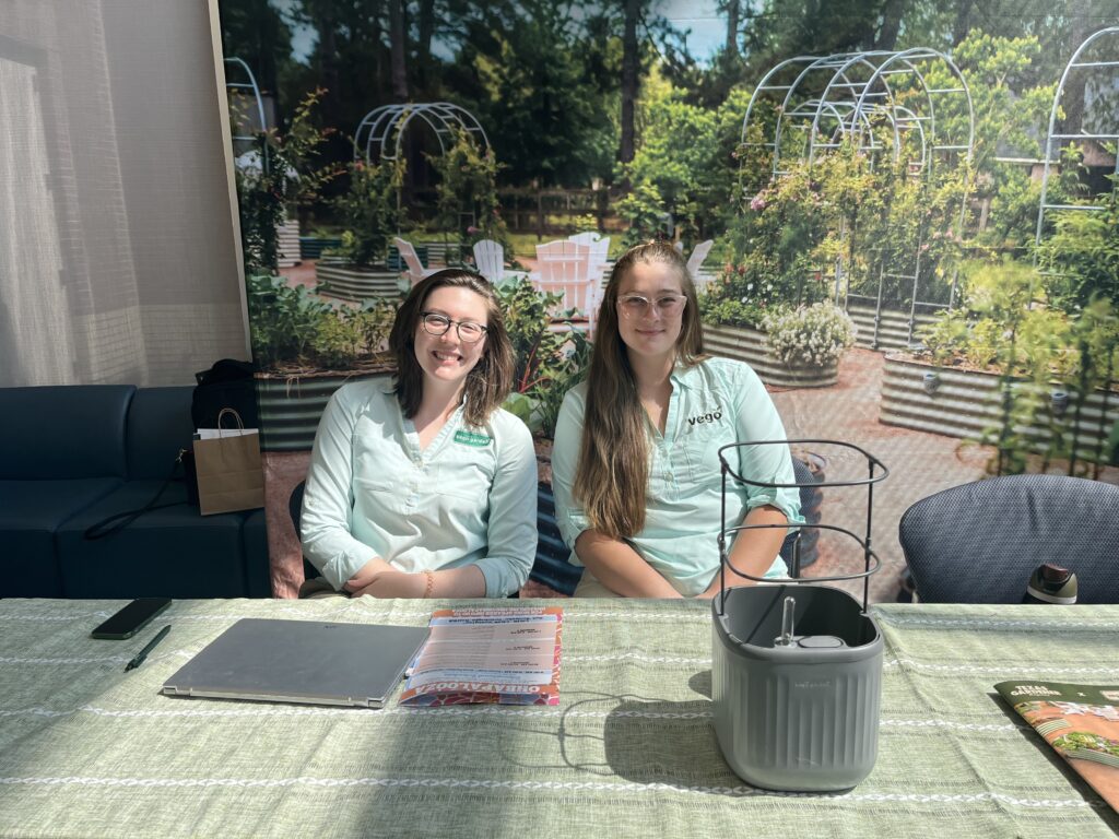 Sarah Mohalley, Sydney Fiene highlight Vego Garden's raised gardening beds at OHBA Palooza. (Photo by Jenna Baer)