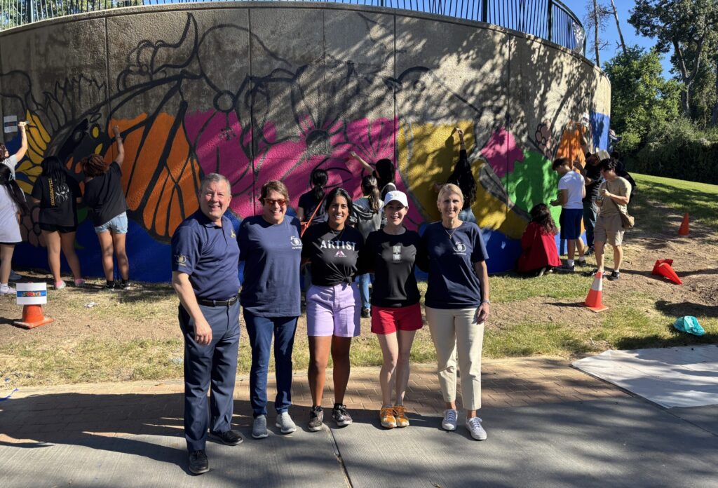 Nick Wolda, Lorrie Parise, artist Amy Malkan, artist Marlo Saucedo and Kim Phillips all had a hand in the mural at the Community Paint Day.