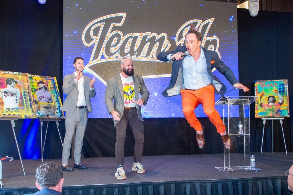 Johnny Bravo encouraging high bidding during the auction at the 'Team Up' fundraiser (Photo by Jacob Power)