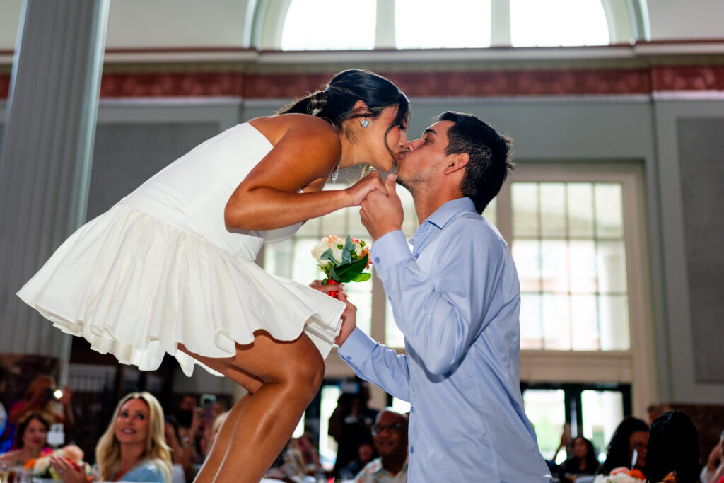 The pregnant Nancy Dubon got a big kiss from Mauricio Dubon at the end of the fashion runway. (Courtesy Astros)