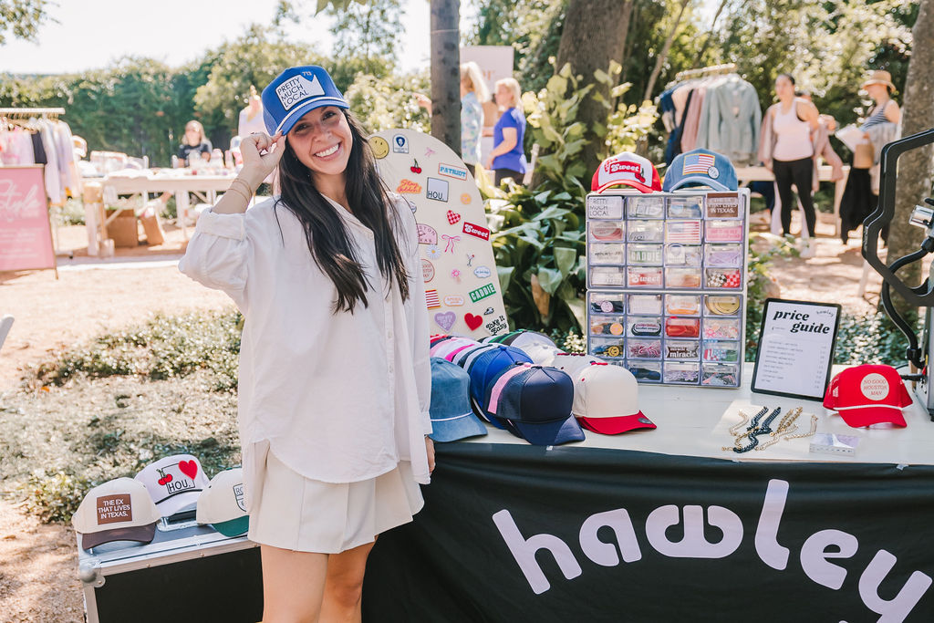 Madelyn St. Germain models one of Hawley Trucker Hats' stylish creations at PaperCity's Nourish retreat. (Photo by Heather Robards)