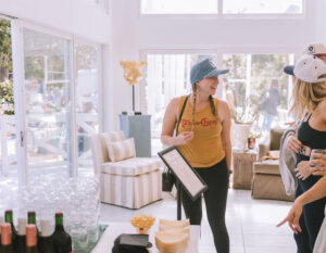 Attendee Erin McGee enjoying the lounge by Alexandra Killion featuring her new line, AK Collective (Photo by Heather Robards)