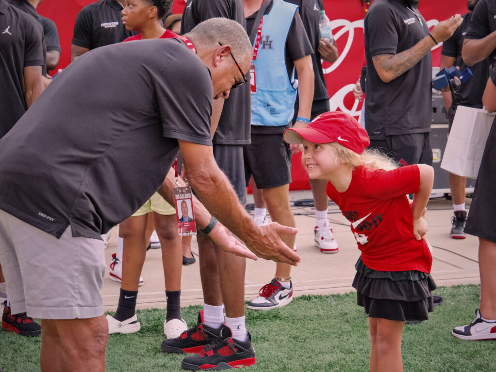 University of Houston basketball coach Kelvin Sampson is always delighted to spend time with his granddaughter Maisy Jade Sampson, (Photo by F. Carter Smith)