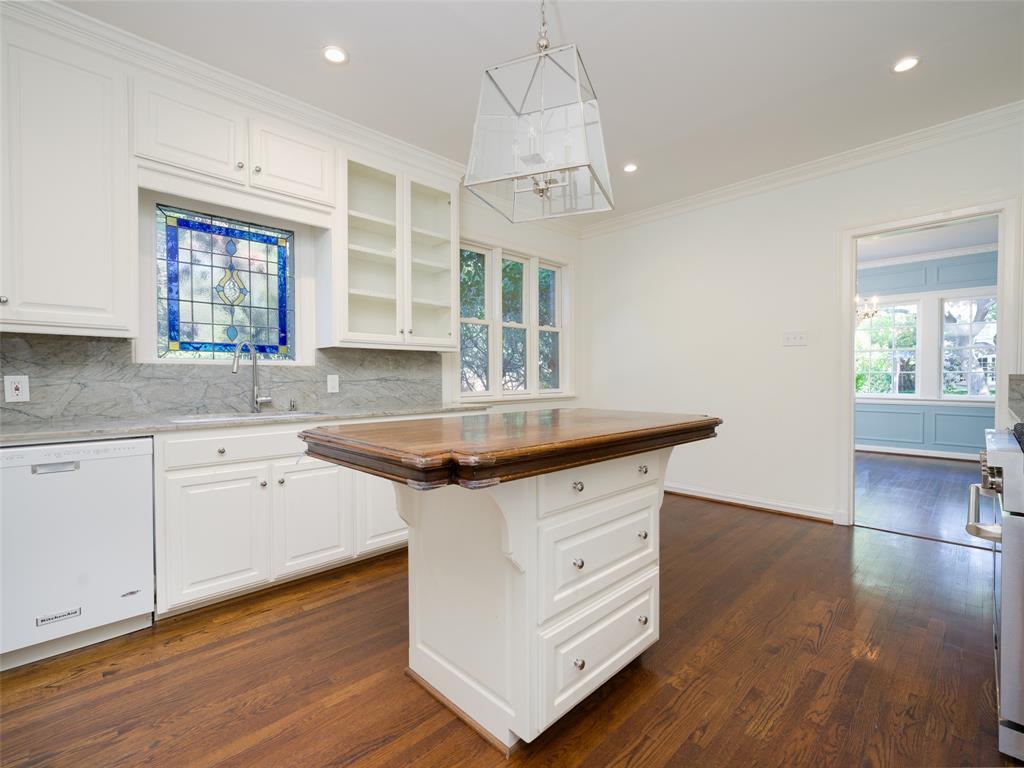 This unique home has already been given a few modern upgrades, like a stainless steel kitchen range, refinished flooring, and a new HVAC system.