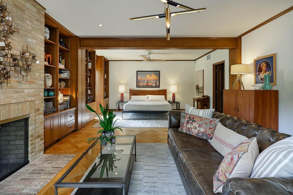 The single-story home features indoor gardens, a wet bar, a great room, and a three-car carport.