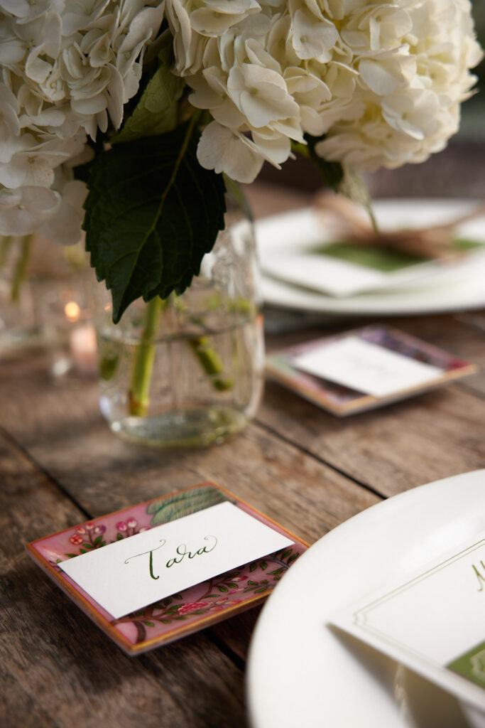 Place cards were calligraphed by Nancy B. Creative, placed atop a special gift for guests — a handpainted marble tray from Surya and the Moon. (Photo by Nneoma Aiiwe)