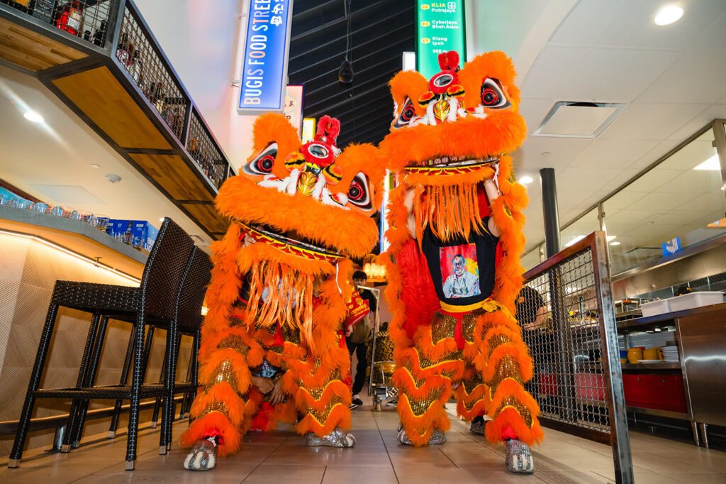 Dinner guests enjoyed a traditional lion dance performance by Lee's Golden Dragon. (Photo by Duc Vo)