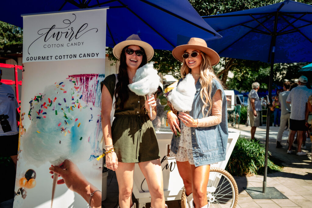 Guests enjoying Twirl Cotton Candy at the Houston Chefs for Farmers event at Autry Park.