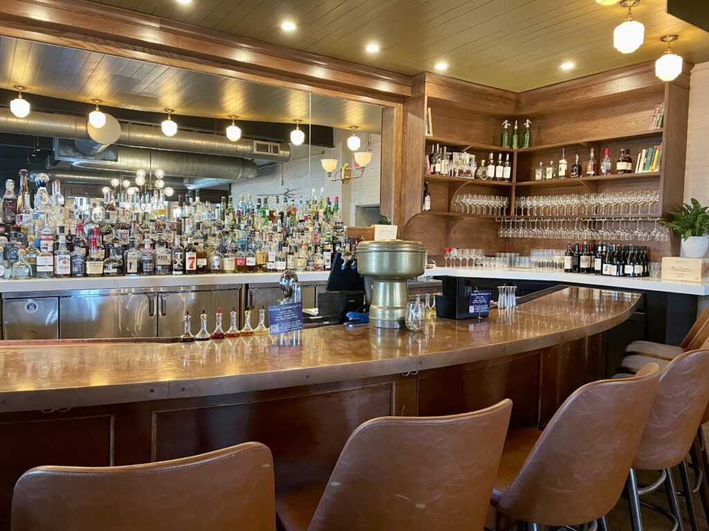 Clay Pigeon's copper topped bar has been refreshed with comfy new seating and a built-in mirror behind the bar back. (Photo by Courtney Dabney)