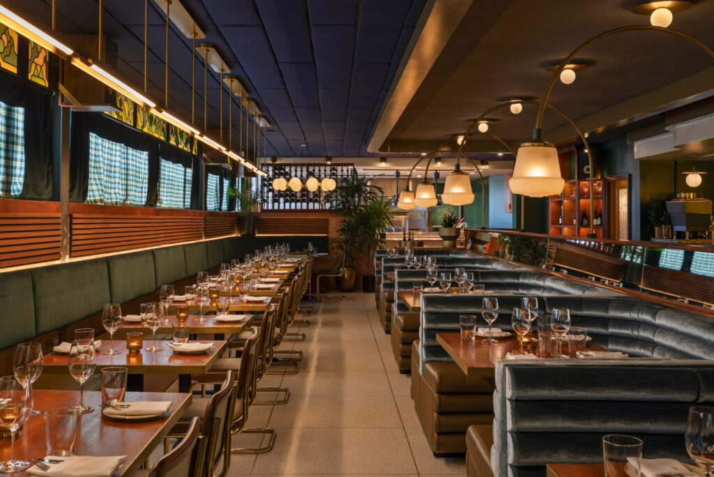 The 2,000-square-foot Italian restaurant Milton's is perched above Levit’s casual, all-day dining concept, Local Foods. Brittany Vaughan of Garnish Design has reimagined what a trattoria could be, embracing a happy, preppy 1970s vibe with a palette of shamrock green and goldenrod. (Photo by Julie Soefer)