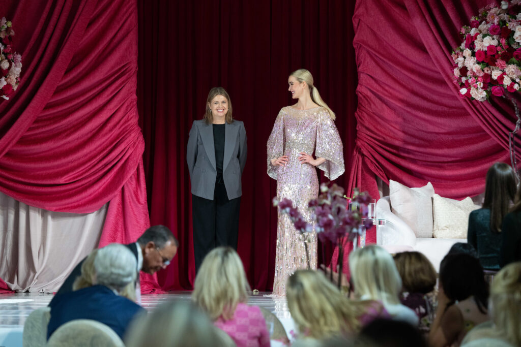 British designer Jenny Packham with one of her dazzling gowns on the catwalk at the Memorial Hermann Foundation Razzle Dazzle Luncheon. (Photo by Daniel Ortiz)