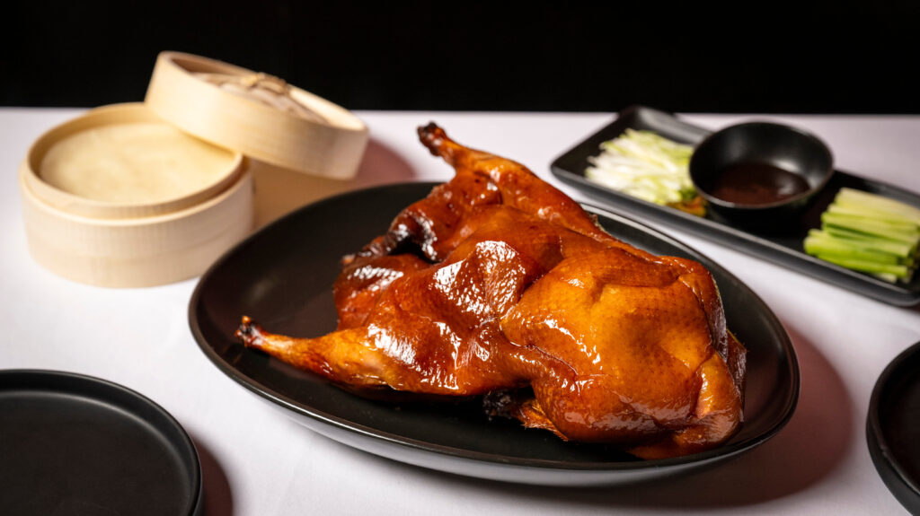 Le PasSage offers a whole Peking Duck for four people. (Photo by Evan Sung)