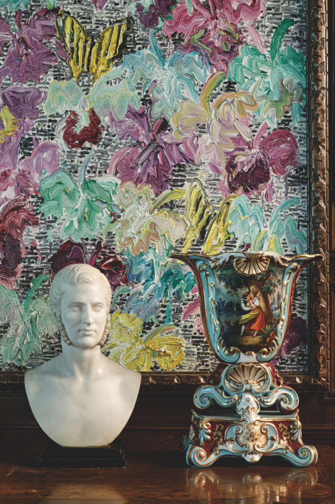 A porcelain vase and the artist's "Cattleyas" in Searles Castle, Great Barrington, Massachusetts. (Photo by John Neitzel)