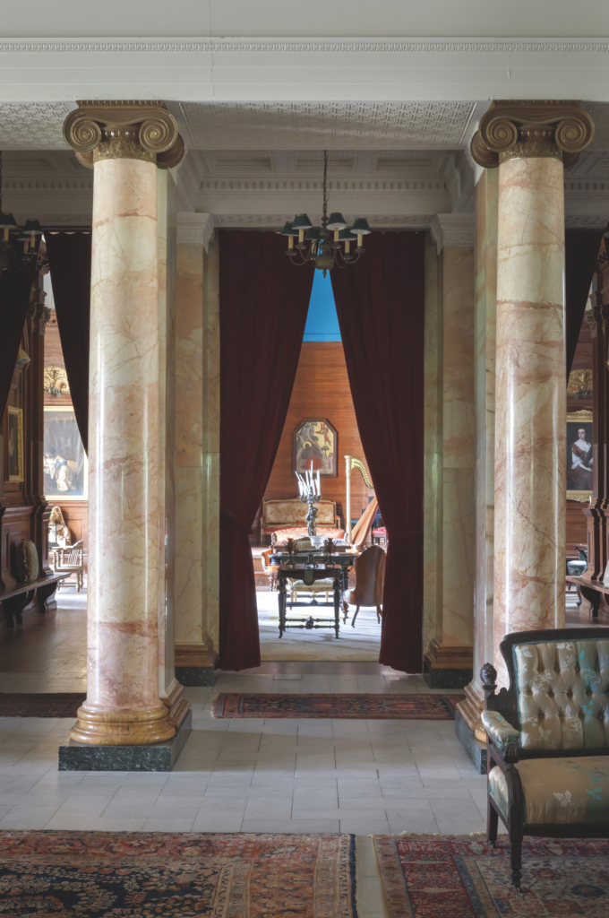The two-story atrium at Searles Castle highlights Hunt Slonem's love affair with Gilded Age mansions. (Photo by John Neitzel)