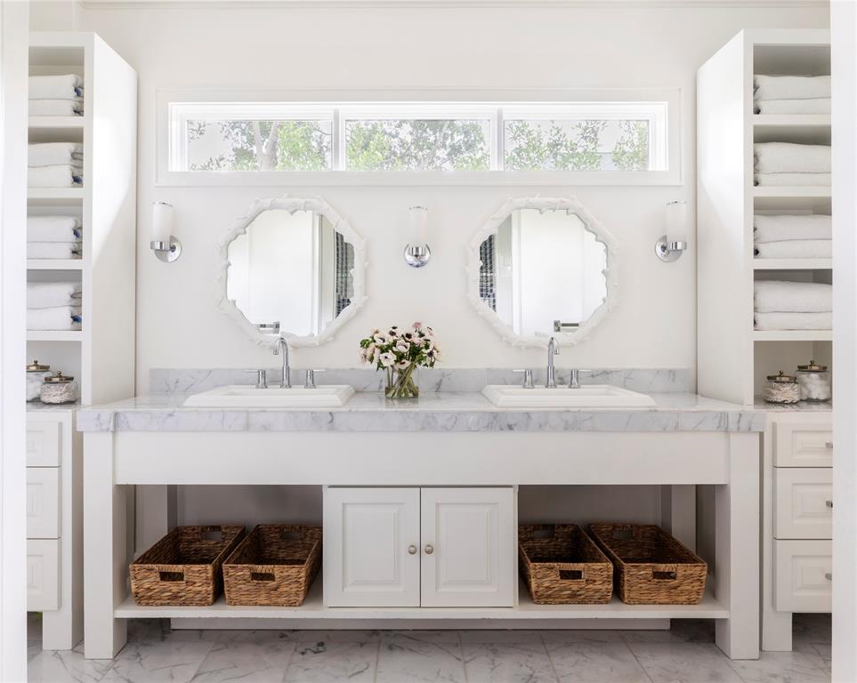Double-sink bath for one of the five bedrooms exude a special charm.
