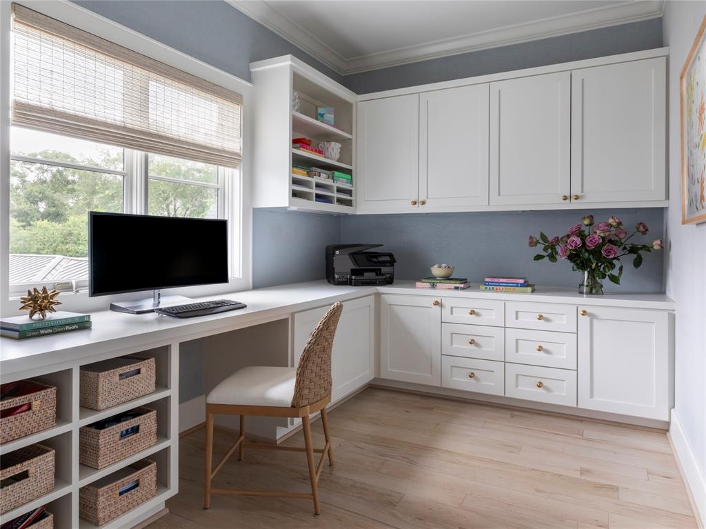 A spacious second floor home office just right for planning charity board meetings and vacation outiongs.