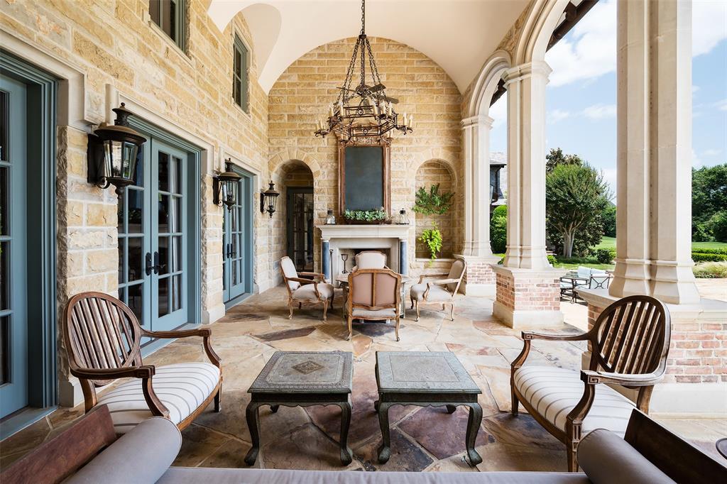 Outside, 10540 Lennox Lane features a pool, spa, fire pit, ponds, and a water well. (Courtesy)