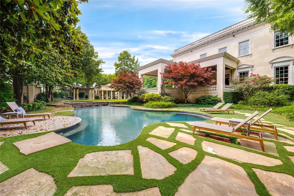 The backyard at 10777 Strait Lane includes a pool, formal gardens, a tennis court, and more. (Courtesy)