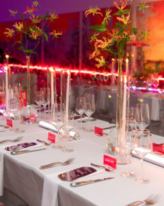 At Dallas Contemporary’s gala, moody uplighting transformed the room, providing guests, seated at long banquet tables and discussing their favorite artists, a warm glow. (Photo by Kaitlin Saragusa)