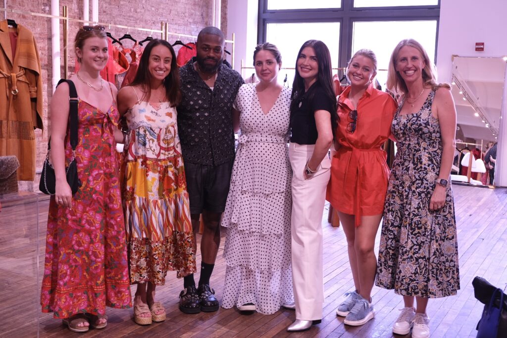 Emily Kate Bell, Kara Bell, Carl Curry, Mallory Brown, Bonnie Thompson Smith, Connaly Bell, Natalie Martin enjoy the experience of a first fitting. (Photo by Beth Hutson)