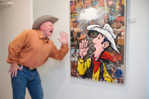 Jacques Fox gets into the “Frenchies & Friends” opening celebration at Alliance Française de Houston. (Photo by Charlie Horse Photography)