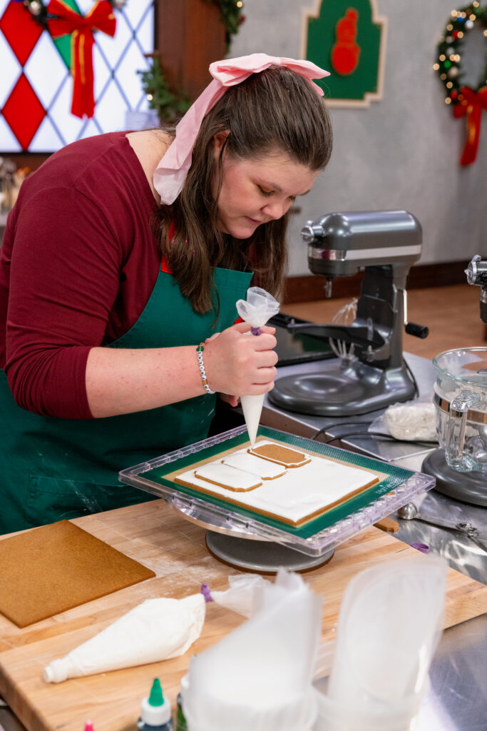 Contestant Heather Brookshire ices gingerbread during Season 8, Episode 3 on The Food Network.  (Photo courtesy of The Food Network)