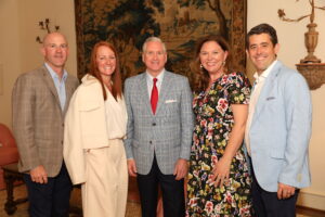 Shane and Cory Bowen, 2024 TRAINS Honorary Chair, G. Brint Ryan; and Becky and Pastor Arthur Jones enjoying the TRAINS Sponsor Party at the home of Beth and Fin Ewing (Photo by Tamytha Cameron Photography)