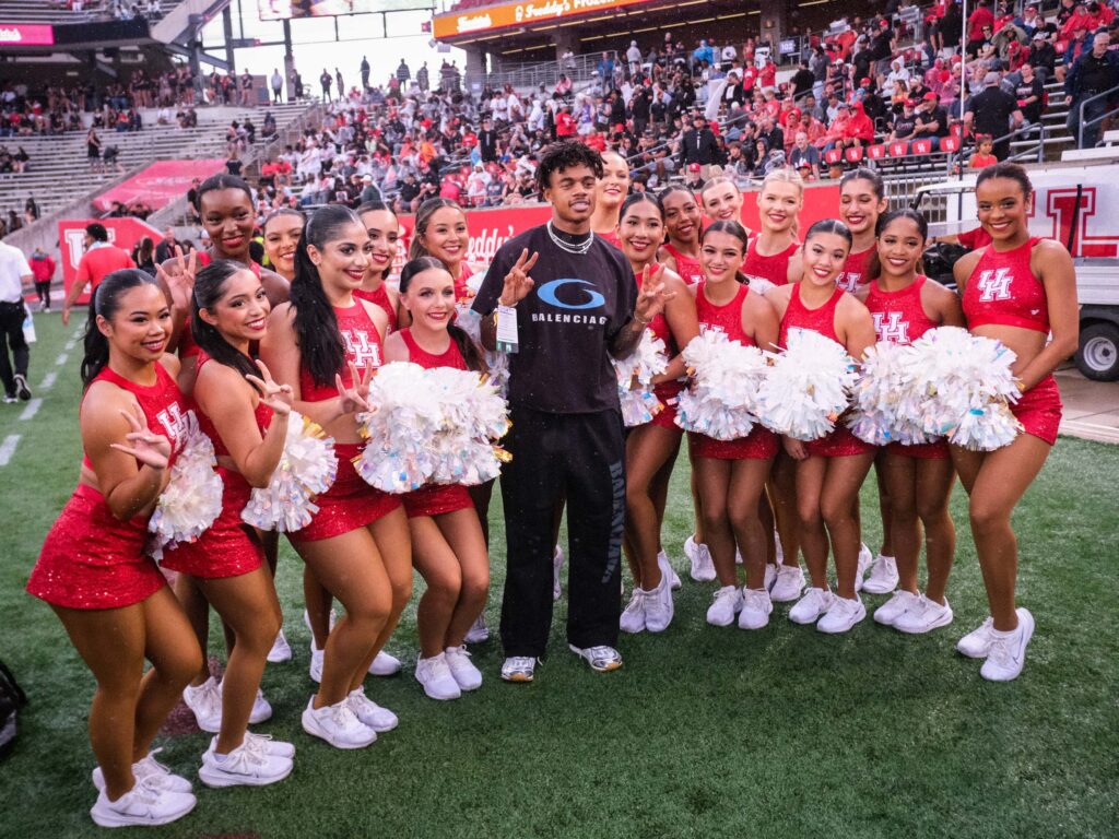 Everyone wants to take a picture with Tank Dell. Including the entire University of Houston cheerleading team.  (Photo by F. Carter Smith)