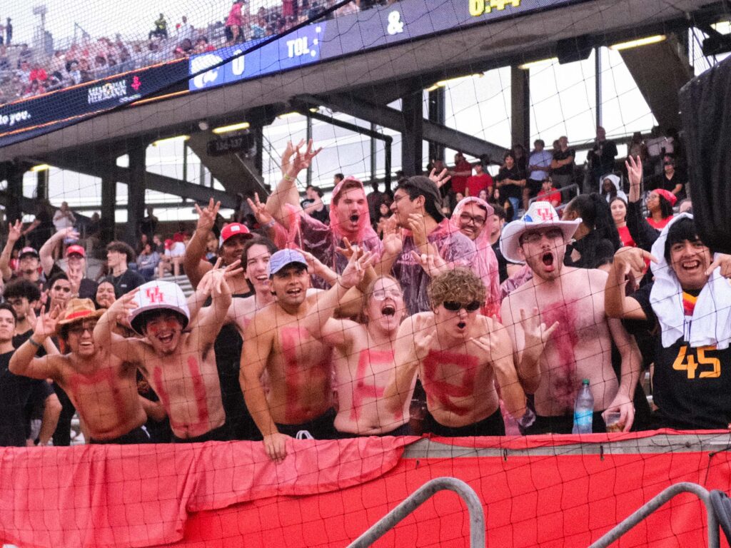 Even with the rain and lightning delay. some stout UH students brought the enthusiasm — and came onto the field for one of the smallest field rushes ever.  (Photo by F. Carter Smith)