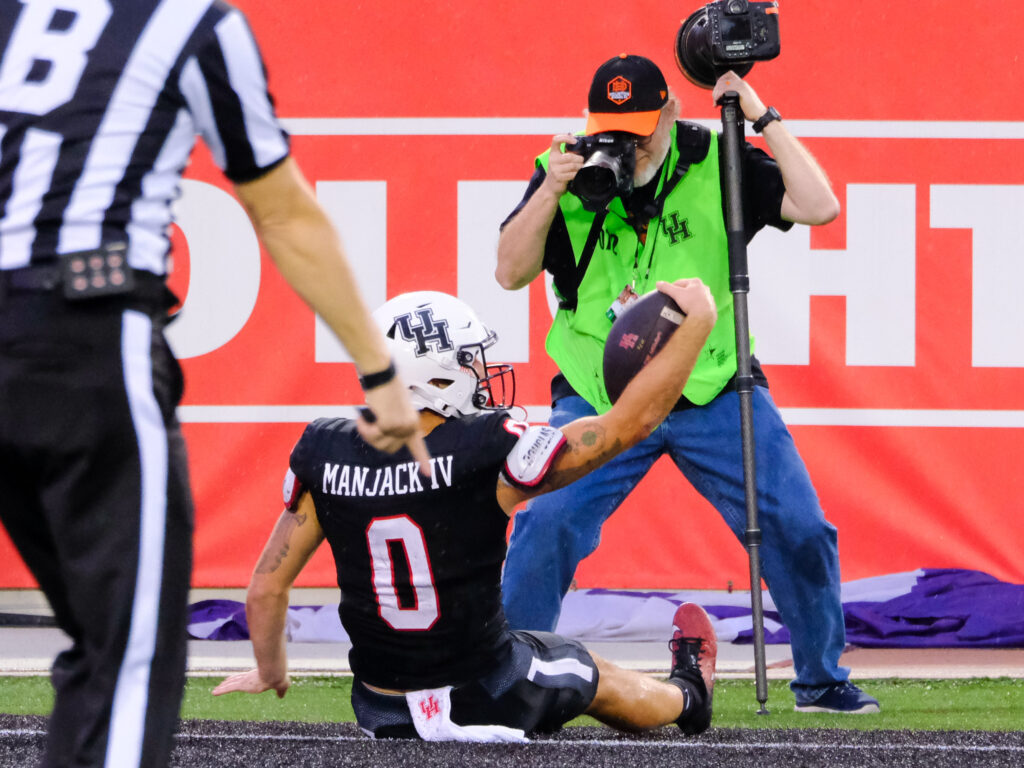 When University of Houston receiver Joseph Manjack makes a play, everyone wants a closeup.  (Photo by F. Carter Smith)
