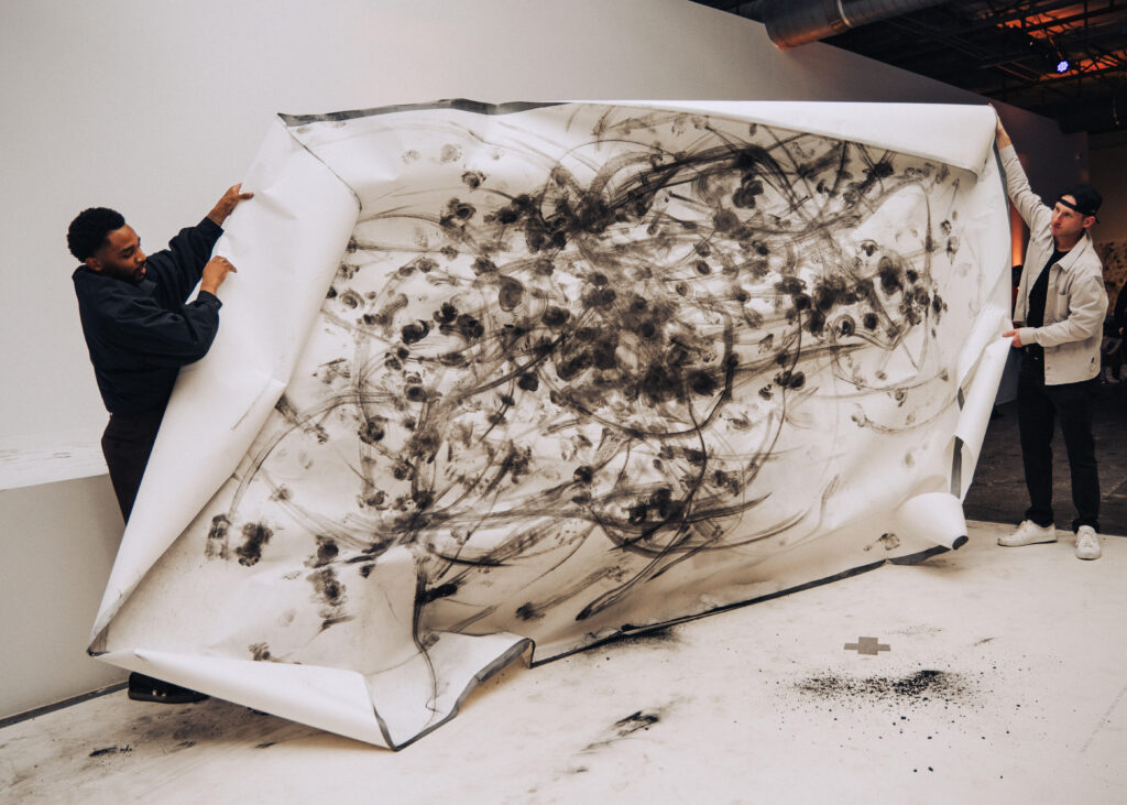 The finished works were then cut up into smaller pieces that guests could purchase to support Pegasus Contemporary Ballet. (Photo by Ethan Rios)