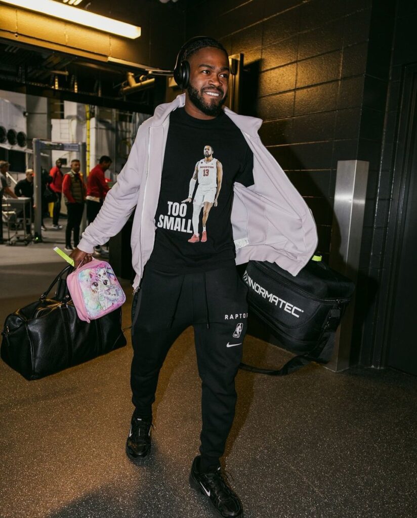 Jamal Shead wore the J'Wan Roberts "Too Small" shirt to a Toronto Raptors game.