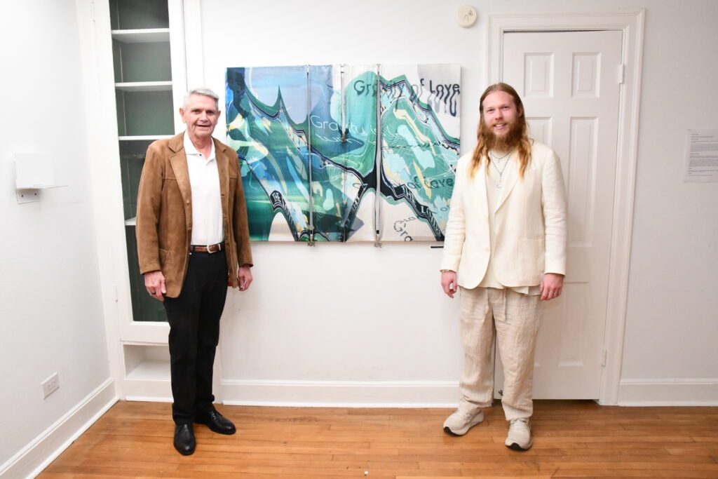 Collector Dan Elsom, Preston Douglas Boyer with custom zipper painting entitled "The Gravity of Love," 2024 at "COUTUME" exhibit at Ruby Projects. (Photo by Valeria Muhala)