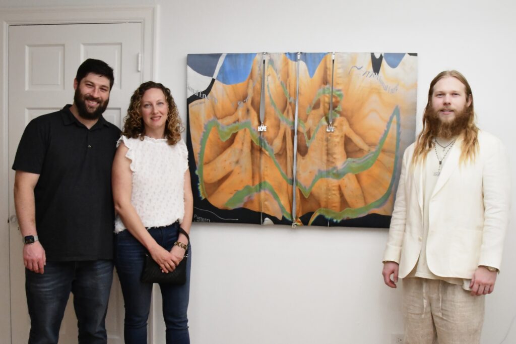 Daniel & Kate Katz with the custom-zipper painting they commissioned from artist Preston Douglas Boyer at Ruby Projects (Photo by Valeria Muhala)