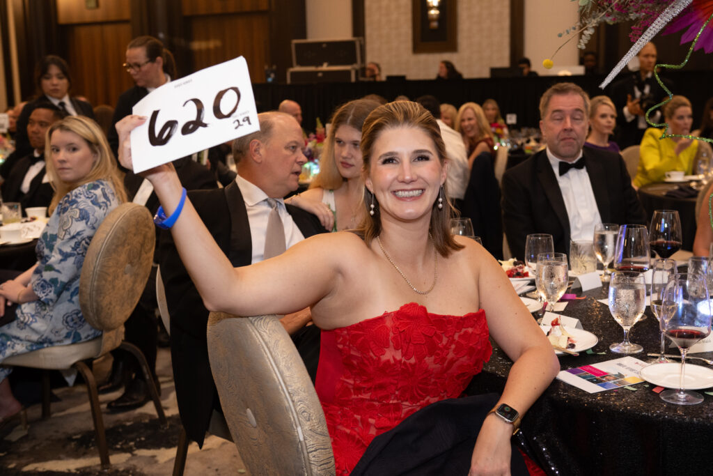 Liz Walsh bidding in the live auction at the British American Foundation of Texas gala (Photo by Wilson Parish)