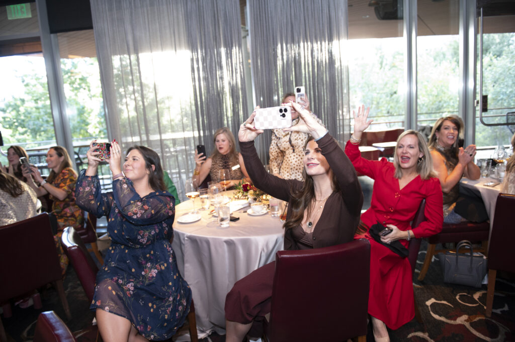 Members react to the check unveiling.  (Photo by Tamytha Cameron)