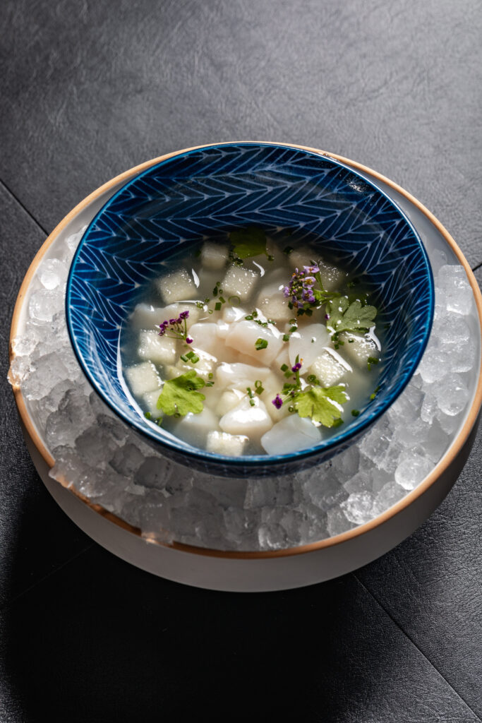 Crudo language is topped tableside with a sea foam that makes this scallop dish at Rye. (Photo by Samantha Marie)