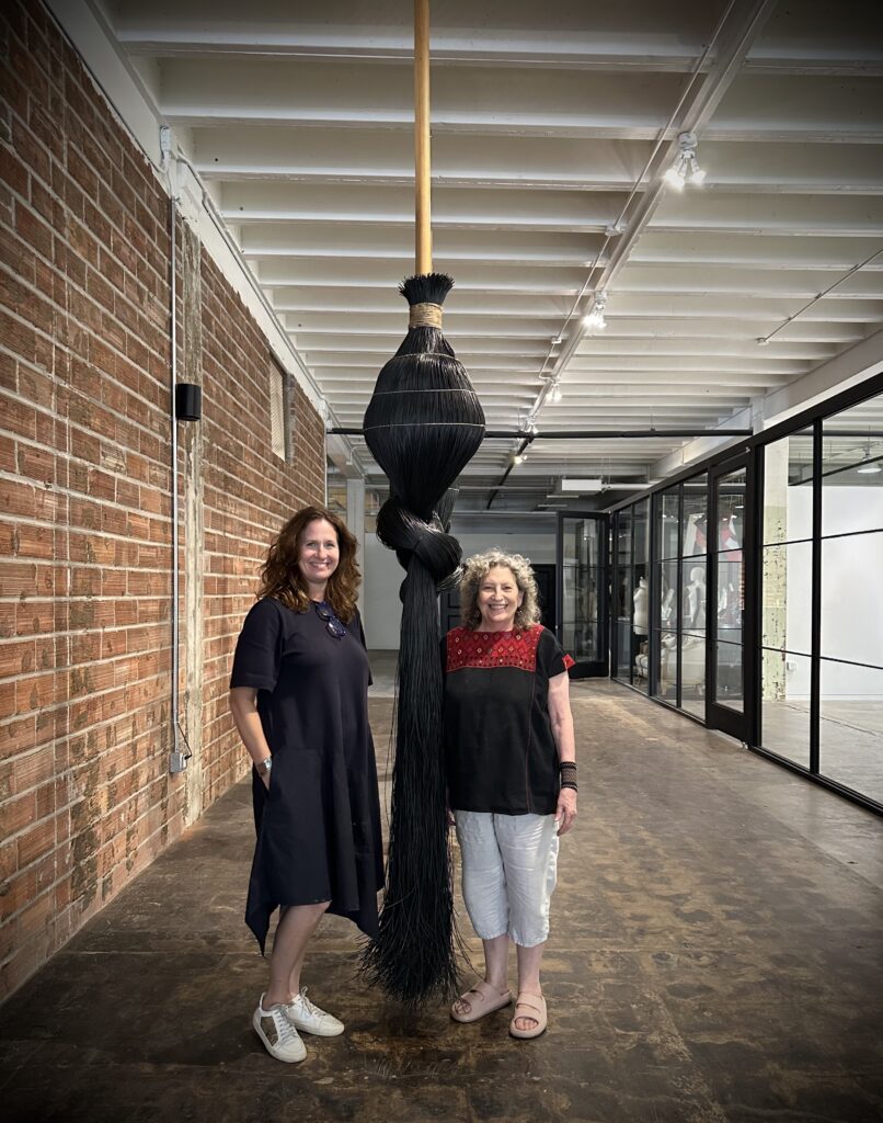 Kelie Mayfield, Susan Plum with the artist’s "Escobas" (Courtesy MaRS Culture)