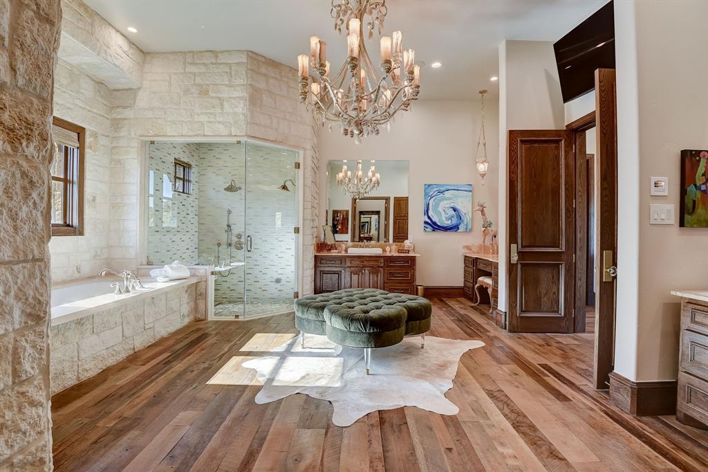 The master bedroom is an absolute dream at 6960 Laurel Valley Drive, as it overlooks one of the course’s lakes and has a massaging spa and steam shower, large walk-in closet, and individual vanities.