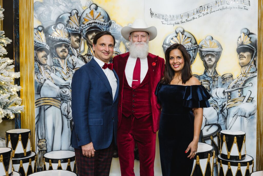 Cody & Kusum Patel with Fashion Santa at the Ambassadors for Texas Children's Hospital holiday party. (Photo by Jenny Antill)