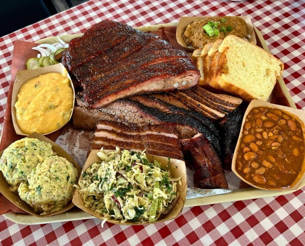 A platter from Goldee's, complete with brisket, ribs, and all the fixings. (Courtesy)